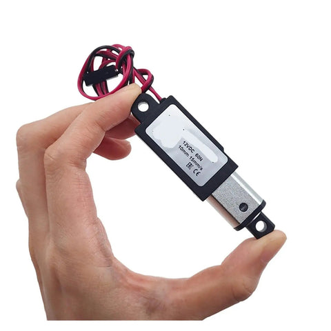 Dead Nuts Reliable Micro Linear Actuator DC 12V Motor With 10mm Stroke And 30N Grip in a hand showcasing its compact design.