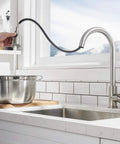 Brushed Nickel Kitchen Faucet With Pull Down Sprayer, filling pot in modern kitchen, one hole install, high arc design