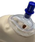 CPR training valve assembly on an AED practice mannequin airway; blue WNL Practi-Valve connector