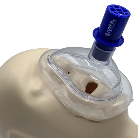 CPR training valve assembly on an AED practice mannequin airway; blue WNL Practi-Valve connector