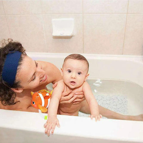 Top Rated Premium Heavy Duty Non Slip Shower Mat For Bathtub With Clear Textured Surface And Rock Solid Suction Cups in use with baby.