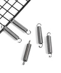 Durable Stainless Steel Extension Springs With Dual Hook Ends, 2 Inch Length, 0.35 Inch Outer Diameter displayed on grid surface