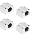 Four white aluminum linear motion bearing blocks for 8mm shafts with round bearing bores.