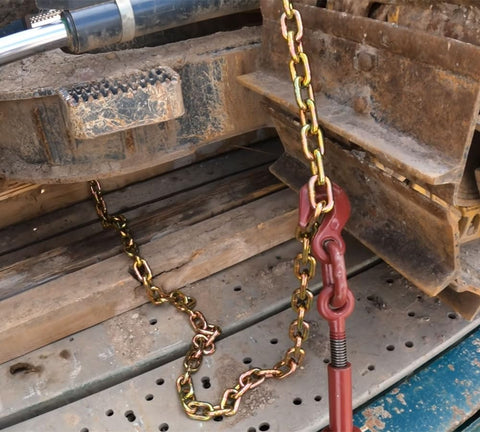 Heavy-Duty Grade 70 Transport Chain And Binder Kit with Four Three-Eighths Inch by Twenty-Foot Chains securing equipment