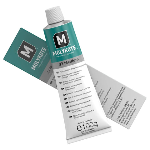 Tube of Molykote 33 Medium grease for metal friction showing bilingual packaging.