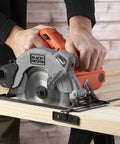 Heavy Duty 1250 Watt Circular Saw Featuring Integrated Laser Guide And Quick Depth Adjustment 190 Millimeter Blade cutting wood on a workbench.