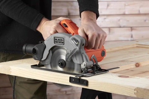 Heavy Duty 1250 Watt Circular Saw Featuring Integrated Laser Guide And Quick Depth Adjustment 190 Millimeter Blade cutting wood on a workbench.