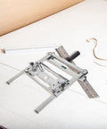 Adjustable Stainless Steel Edge Guide Positioner For Cutters And Grinders Heckin Solid Heavy Duty Metal Workshop Fence on a table.