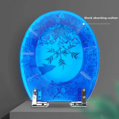 Super Slick Low Drama Auto Closing Toilet Seat With Silent Drop Lid And Transparent Fish Motif Universal Fit For Oval Round Or Square Bowls Heavy Duty Resin For Your Clean Bathroom Glow Up with blue transparent design and shock-absorbing cushion.