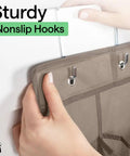 Close-up of hands hanging Over The Door Shoe Organizer With 24 Large Breathable Mesh Pockets And 40 Lbs Weight Capacity, Beige