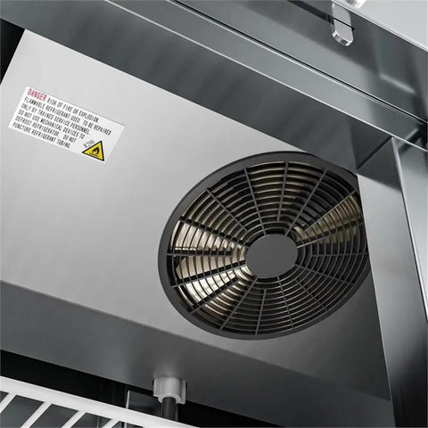 Interior view of Straight Up Heavy Duty Commercial Two Door Refrigerator 35 Cubic Feet Stainless Steel showing fan and warning label.