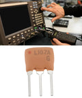 10 Pack Ceramic IF Filter SFE 10.7MA For FM Radio And Wireless Communication Gear Analog Signal Processing 10.7 MHz Intermediate Frequency Filtering To Suppress Noise And Boost Audio Clarity, showing filter and radio testing setup