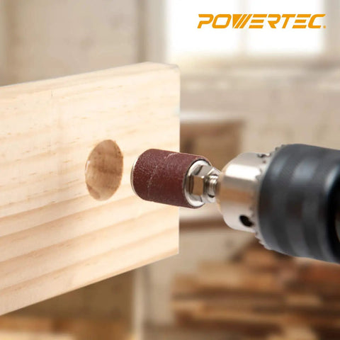 Drill Press Sanding Drum Kit 25 Piece Set With 1/4 And 1/8 Inch Shanks sanding wood with spindle sander sleeve in workshop.