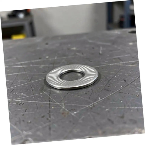 M6 Conical Spring Lock Washers In 304 Stainless Steel Built Tough Industrial Fasteners with serrated edges on a workbench.