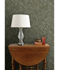 Real Dope Cottage Botanical Wallpaper With Matte Linen Texture And Pvc Free Mix Built For Sturdy Residential Or Commercial Walls That Add A Chill Fresh Vibe To Your Place in a home setting with lamp and wooden table.