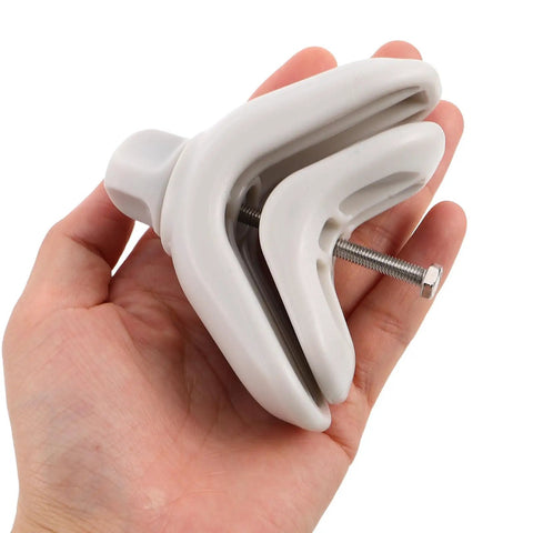 Hand holding a 2 Pack Kids Crib Rail Connector Clips For Playpens, Safe Locking Bed Rail Clamps, Grey, showing the side view.