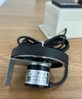 Digital Wheel Roller Encoder And Distance Measuring Counter With Alarm Signal And Relay Output Control, close-up view with cable and mount.