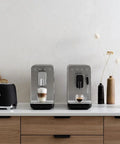 Fully Automatic Coffee Maker With Steam In Black Brings Home Barista Vibe With Six Drink Options From Ristretto To Large Coffee Plus Extra Strong Brews And Hot Water With A Stainless Steel Burr Grinder For Fresh Flavor on a countertop