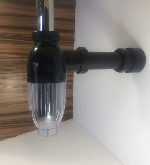 No Mess Money Saving P Trap 2 Pack in black and transparent shown installed under a sink, highlighting its space-saving design.