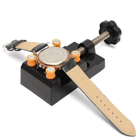 Universal Mini Drill Press Vise Clamp For Jewelry And DIY Projects Table Bench Vise holding a watch for repair.
