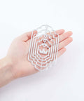 Hand holding Five Set Of Thirty Six Bookmark Die Cuts And Tag Dies With Embossing Stencils for scrapbooking crafts
