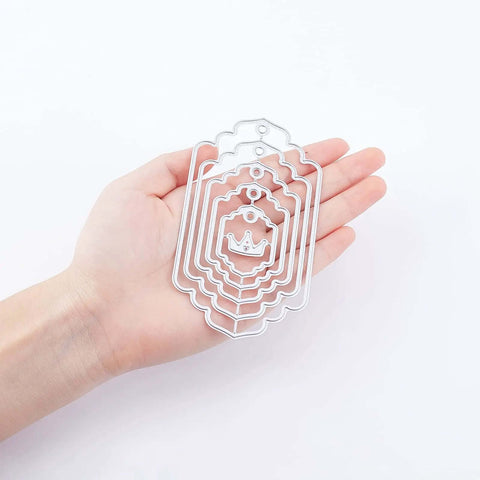 Hand holding Five Set Of Thirty Six Bookmark Die Cuts And Tag Dies With Embossing Stencils for scrapbooking crafts