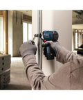 Person using 12V Max Impact Driver Kit With 930 In Lbs Torque Ultra Compact Five Point Four Inch Head For Tight Spaces Lightweight At Just Over Two Pounds No Load 3100 BPM Pro Grade Power For Everyday Jobsite Use on metal frame.
