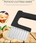 Angled side view of Kakalote crinkle cutter with black handle and stainless steel blades for potatoes and vegetables