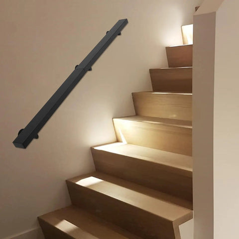 Kick Ass Heavy Duty Wall Mount Handrail In Matte Black Stainless Steel With Non Slip Grip For Modern Indoor Stairs installed on wooden stairs.