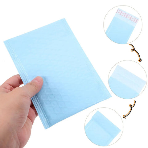 Hand holding Milk Blue Bubble Mailers 11x15 Plus 4 Inch self-seal padded envelopes with close-up of adhesive seal feature
