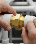 Hands installing Brass Union Fitting 3/8 Inch NPT Male To 3/8 Inch NPT Male 2 Pack in white piping, demonstrating easy assembly.