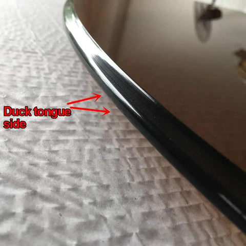 Close-up of 360 Degree Heavy Duty Lazy Susan Turntable edge with 'Duck tongue side' label, showing tempered glass thickness.