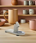 Heavy Duty Plastic Glue Stick Organizer Stand With Deep Trenches For Hot Melt Adhesive Pens on wooden table in craft space