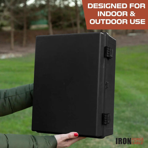 Person holding Extra Large Waterproof Outdoor Junction Box With Hinged Panel Cover, Weatherproof IP65 Electrical Enclosure in park.