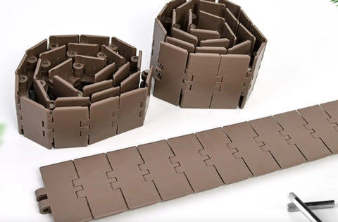 Rock Solid One Meter Flat Top Conveyor Chain With 38.1mm Pitch And 152.4mm Width Single Hinge Direct Drive Transmission For Beverage Lines Built Legit With Hella Durable Pom Resin For Smooth Operation, brown flexible interlocking chain.