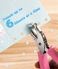 12 Piece Handheld Hole Punch Kit With Grip Handles One Quarter Inch Circular Punches for craft paper, showing pink-handled punch in use.