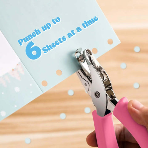 12 Piece Handheld Hole Punch Kit With Grip Handles One Quarter Inch Circular Punches for craft paper, showing pink-handled punch in use.