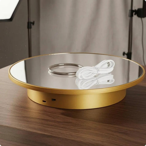 Premium Electric Rotating Display Stand With Mirror Black Finish Perfect For Online Sellers And Photographers Who Want To Spin Products Smoothly. Close-up of the golden turntable with mirror top and power cord.
