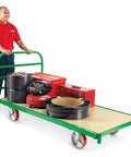Rock Solid 8X2 Inch Swivel Casters Kingpinless Polyurethane Wheels on a loaded platform truck with tools and equipment.