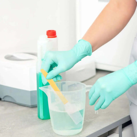 Person using Must-Have Resin Cleanup Kit With 10 Silicone Spatulas And Plastic Scrapers For UV Resin 3D Printers