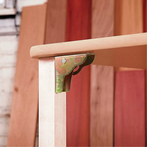 Heavy Duty 8 Pack Foldable Support Brackets Featuring Self Locking Spring Hinge Built Tough Angle Leg Extensions For Tables And Folding Workbenches Quick Release Frame Saves Space, shown mounted on table leg.