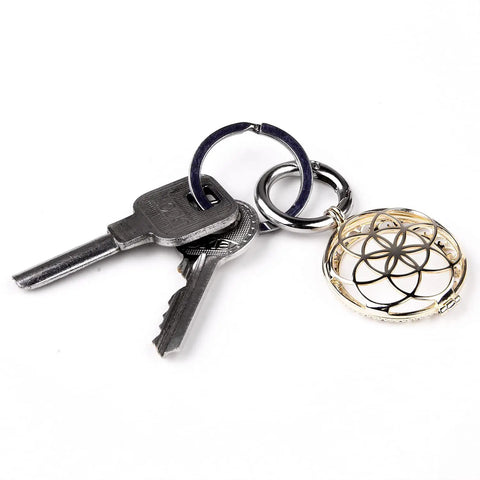 Gold Metal AirTag Protective Case And Key Ring Holder For Apple AirTag 2021 with keys, showing elegant design and utility.