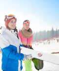 Rustic White Wooden Ski Shot Board Set For Four Players Pub Trivia Drinking Game With Fifty Marked Cups And Included Marking Pen outdoors in snow.