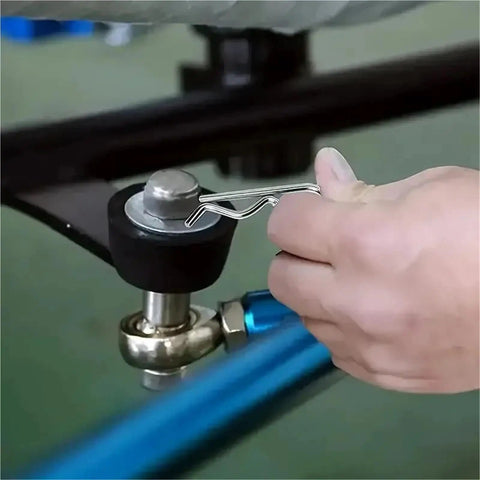 Hand using Premium Stainless Steel Cotter Pin Set Kit With Three Box Assortment For Tractor Clips And Mechanical Hitch Pins