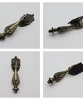 Antique Brass Drop Pull Handles 4 Pack Featuring Ornate Pendant Drawer Knobs With European Scrollwork Base Zinc Alloy Hardware