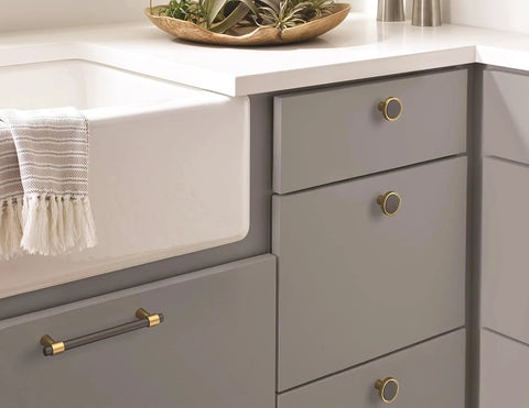 Mergence Cabinet Pull in Matte Black Champagne Bronze, Five And One Sixteenth Inch Center To Center, installed on kitchen drawer
