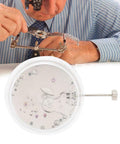 No 6498 Mechanical Watch Movement Automatic Replacement Part in packaging with watchmaker adjusting gears in background