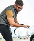 Man using Hella Slick High Performance Water Sprinkler Head with Zinc Alloy Nozzle for Heavy Duty Garden Irrigation and Car Wash.