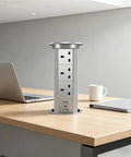 Auto Rises Pop Up Outlet Slick Aluminum Desk Power Strip With Swappable Modules Quick Charge Ports And Optional Speaker on office desk