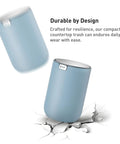Ultra Compact 1.5L Mini Tabletop Trash Can With Swing Lid For Bathroom Vanity Or Desk Space Saving 4.7 Inch Diameter 6.5 Inch Tall Small Garbage Bin For Office Countertop falling onto cracked surface